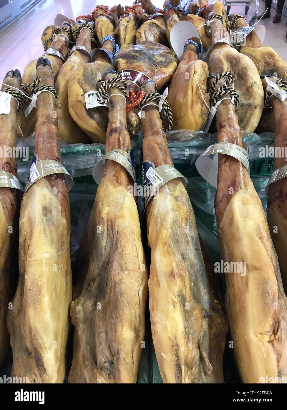 Serrano Jamon / Serrano ham in a Spanish supermarket Stock Photo