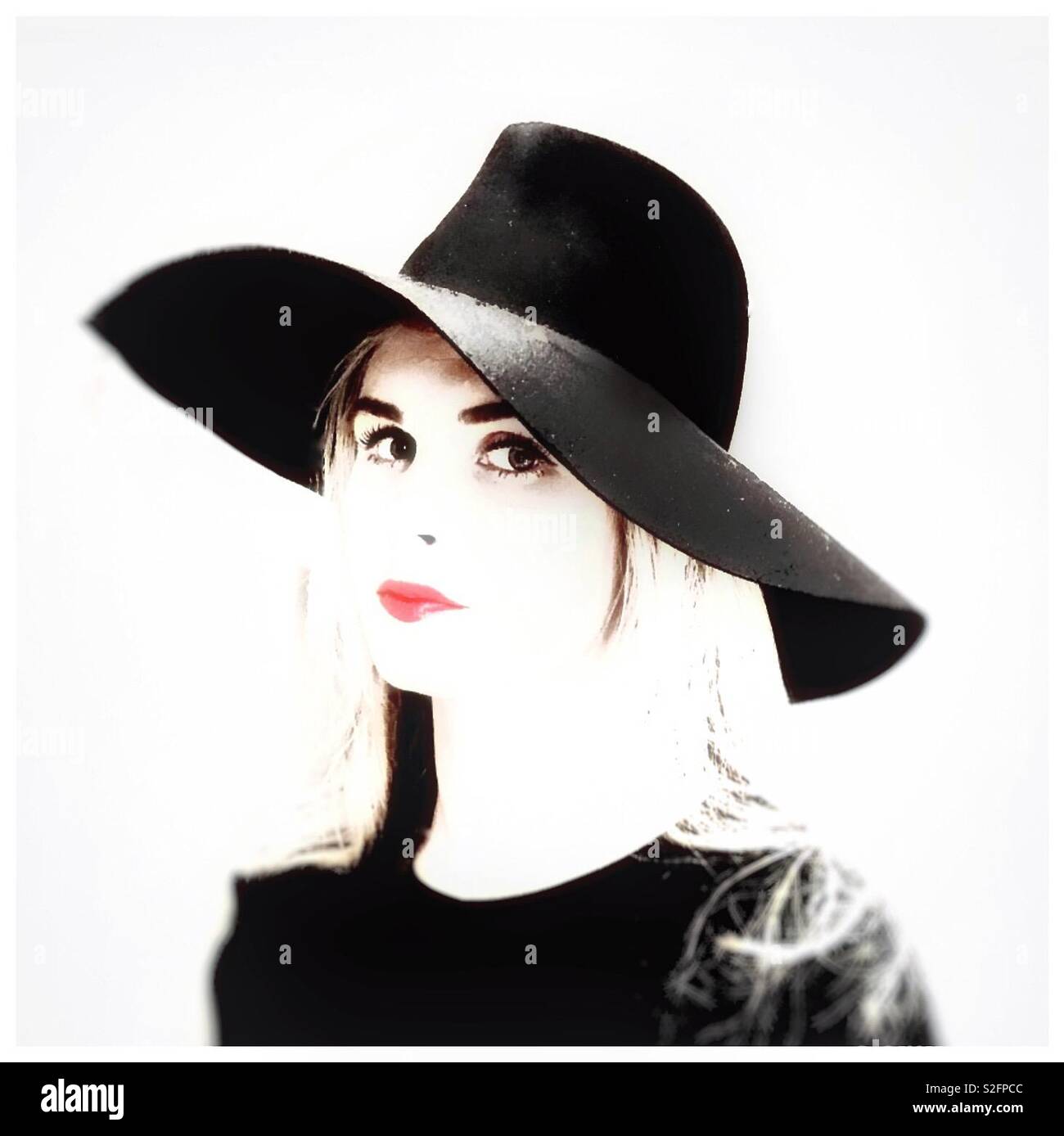 Attractive young woman in a black hat. - Smartphone Captured Stock Image