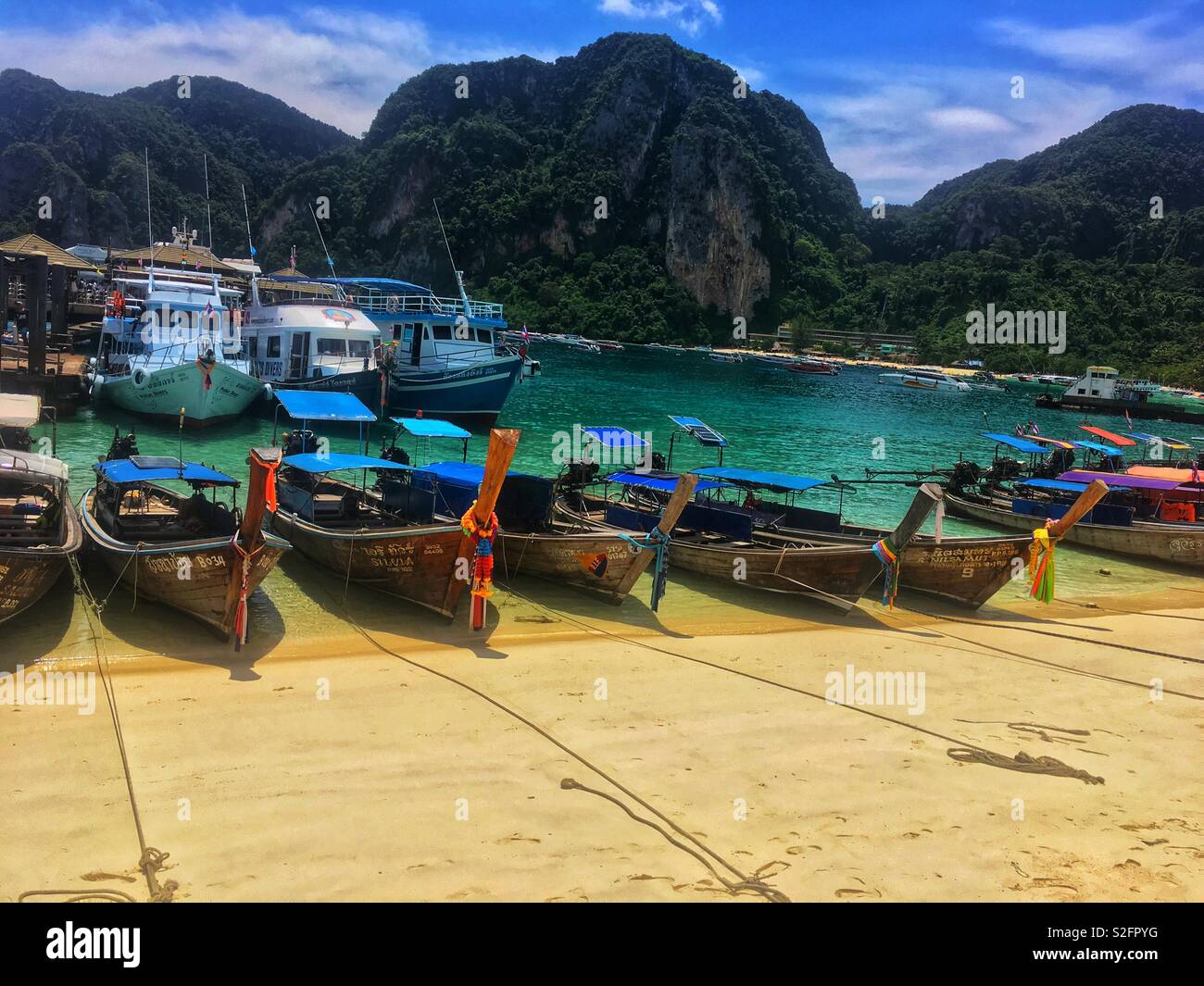 Long tail boats on Phi Phi Island Stock Photo