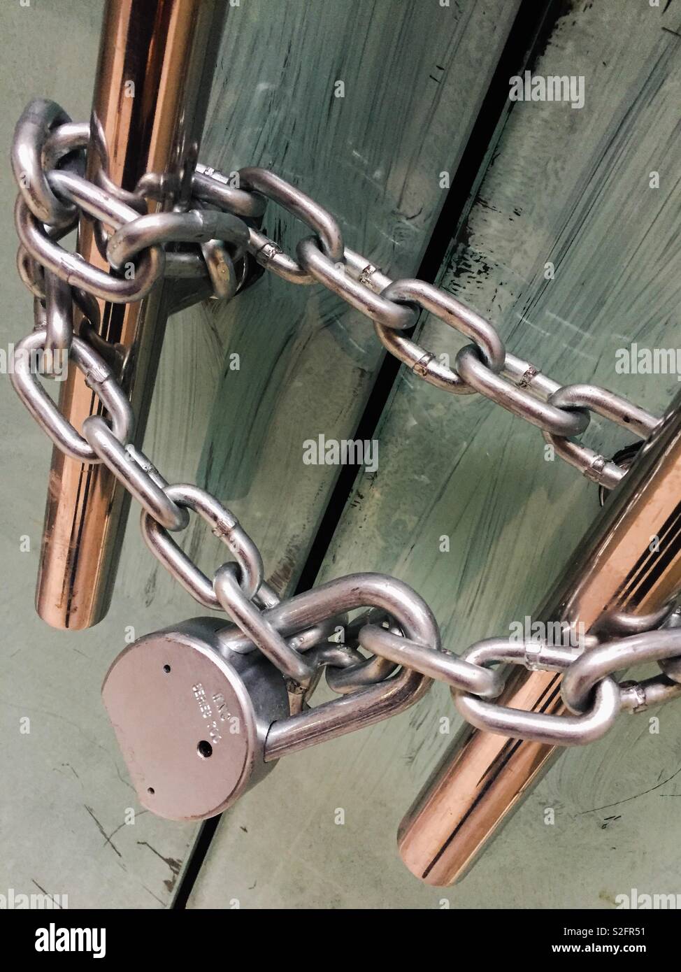 Chain and padlock on doorhandles - Smartphone Captured Stock Image