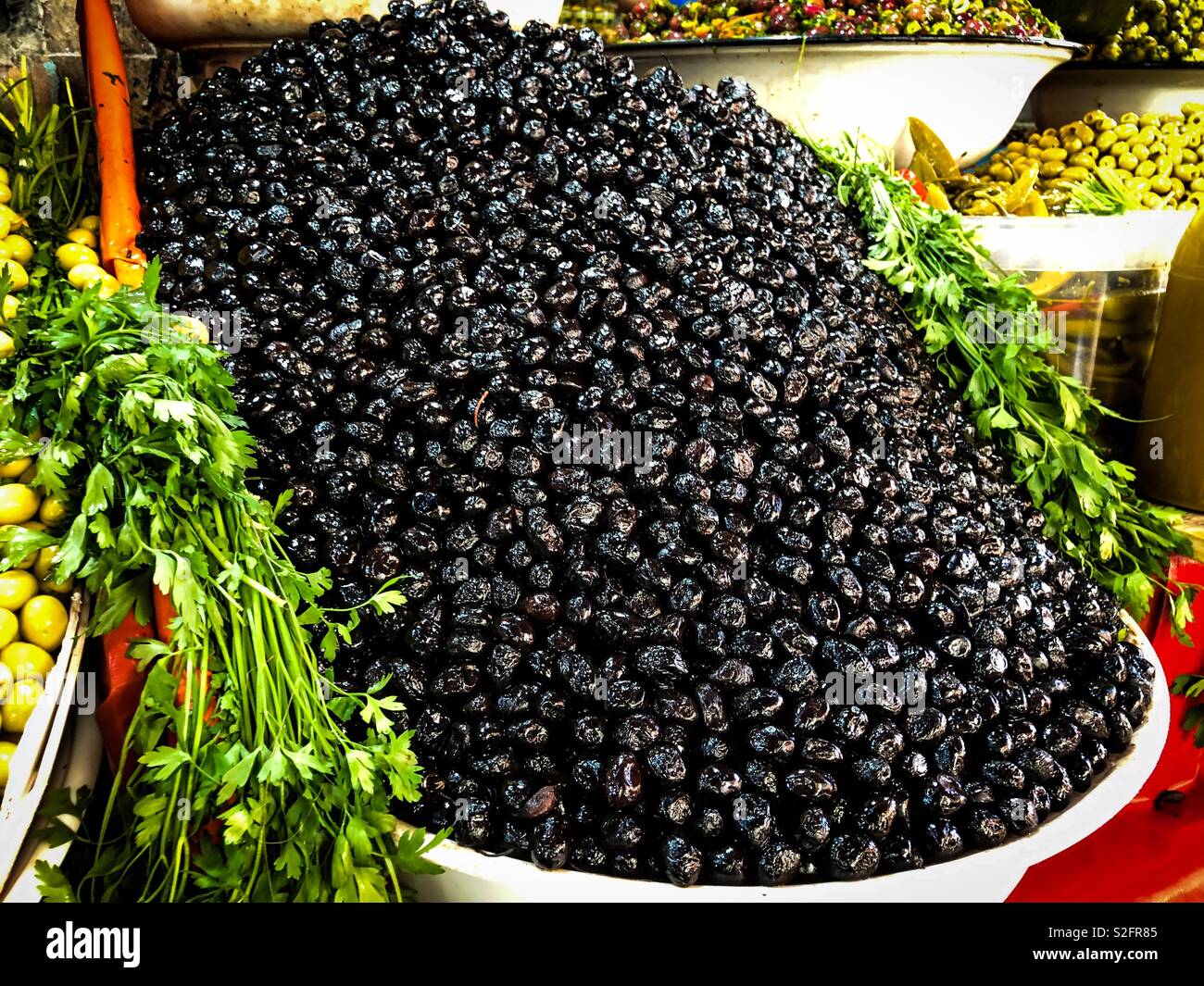 Olives for sale at a souk market in Morocco - Smartphone Captured Stock Image