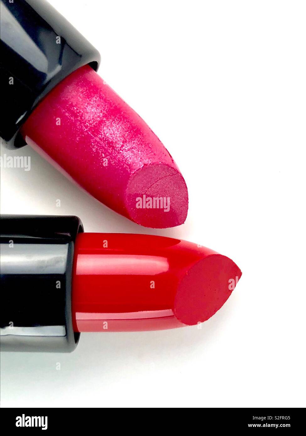 Brightly colored lipsticks on white background - Smartphone Captured Stock Image