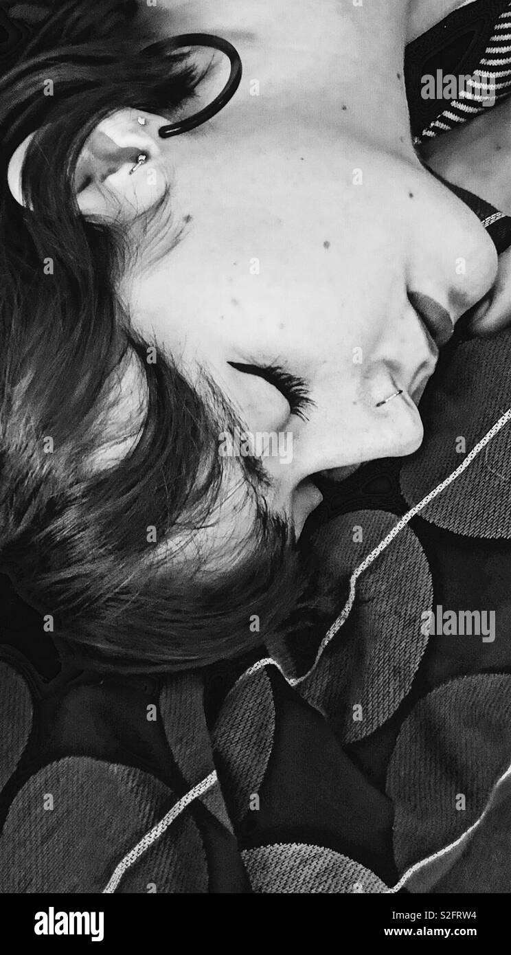 Beautiful young upside down woman sleeping - Smartphone Captured Stock Image