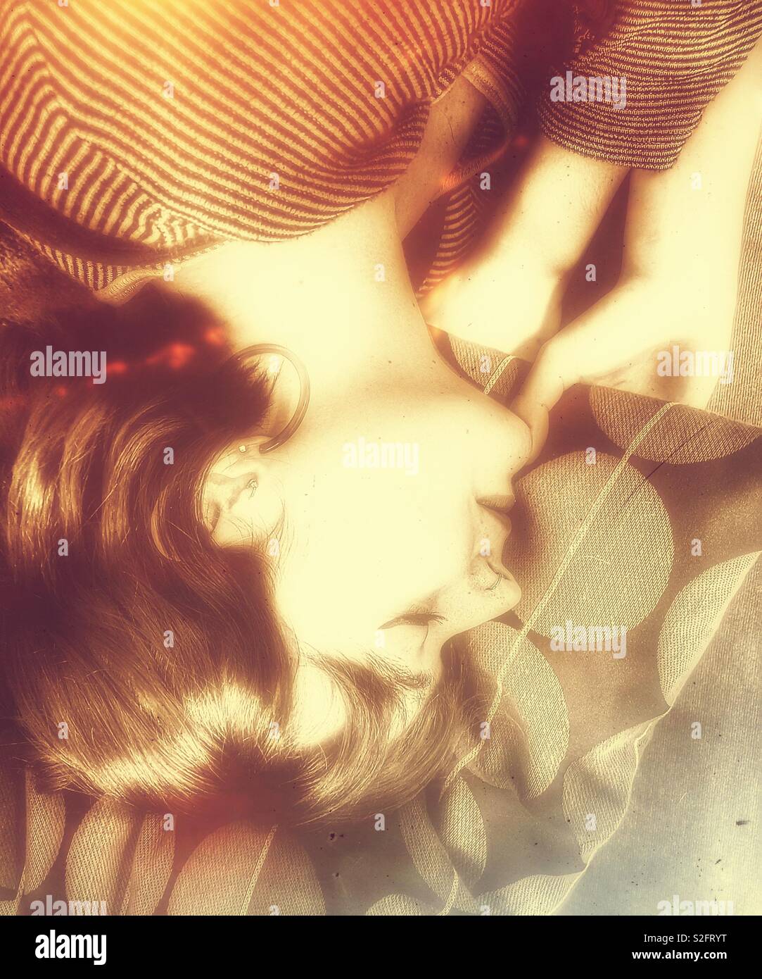 Young beautiful adult upside down woman sleeping - Smartphone Captured Stock Image