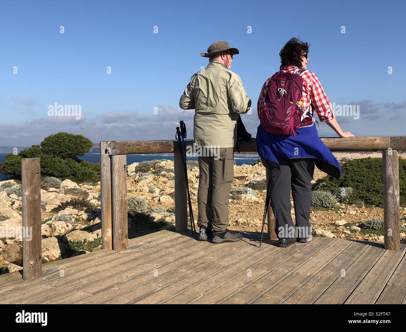Two walkers at a look out point on the Pontal da Carrapareira trail on the Vincent’s coast of Portugal - Smartphone Captured Stock Image