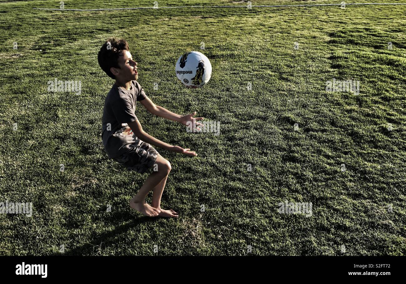 Boy playing with ball Stock Photo