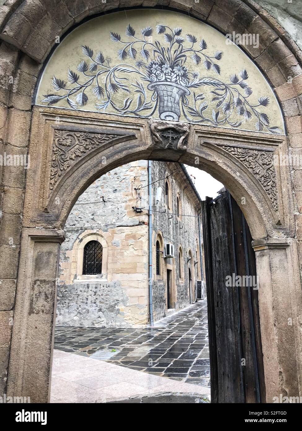 The entrance to a medieval church in Plovdiv, Bulgaria. - Smartphone Captured Stock Image