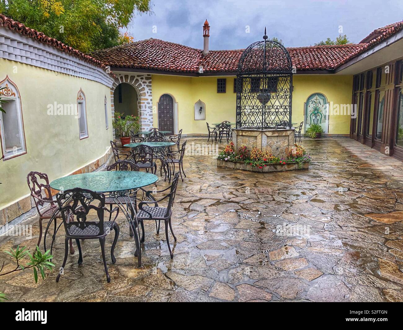 A wet courtyard patio in Plovdiv, Bulgaria. - Smartphone Captured Stock Image