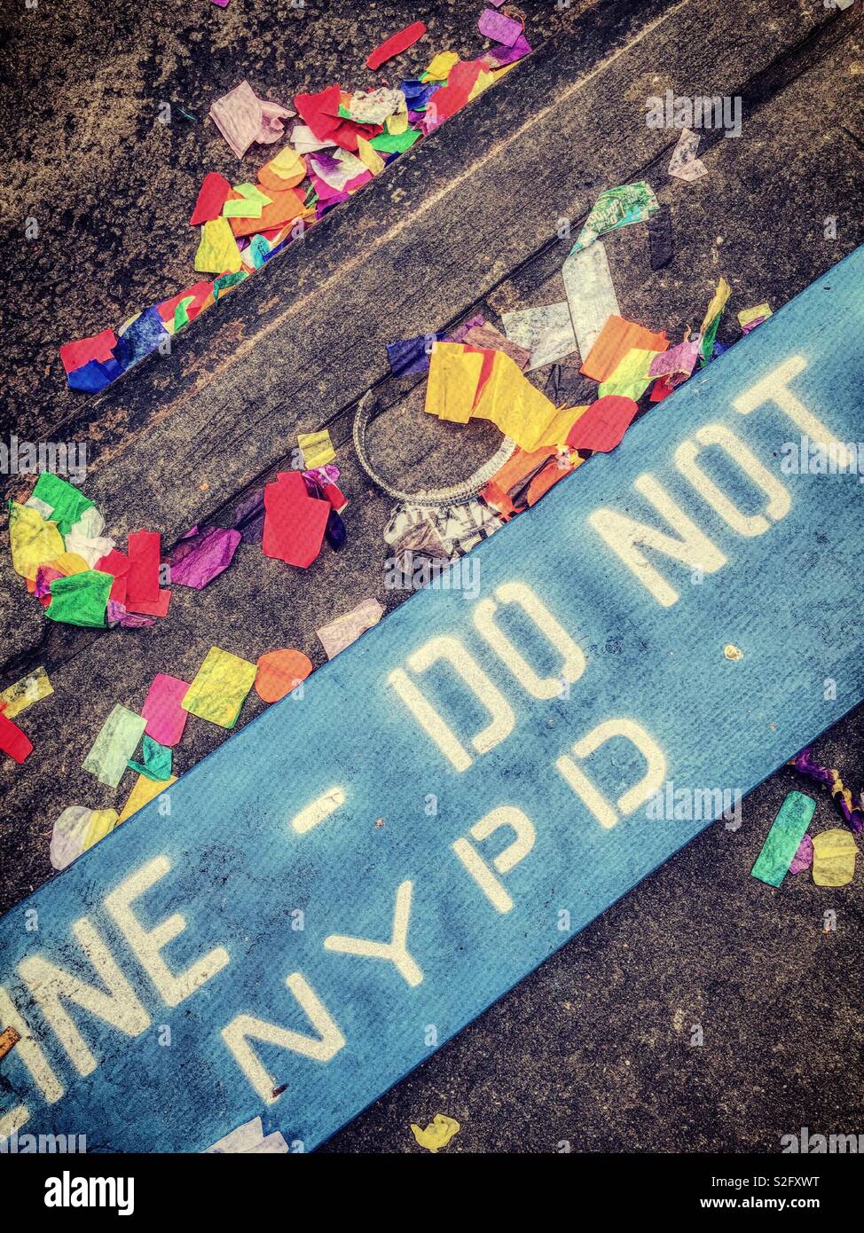 Confetti from Times Square new years eve celebration 2019 with NYPD wooden barrier Stock Photo