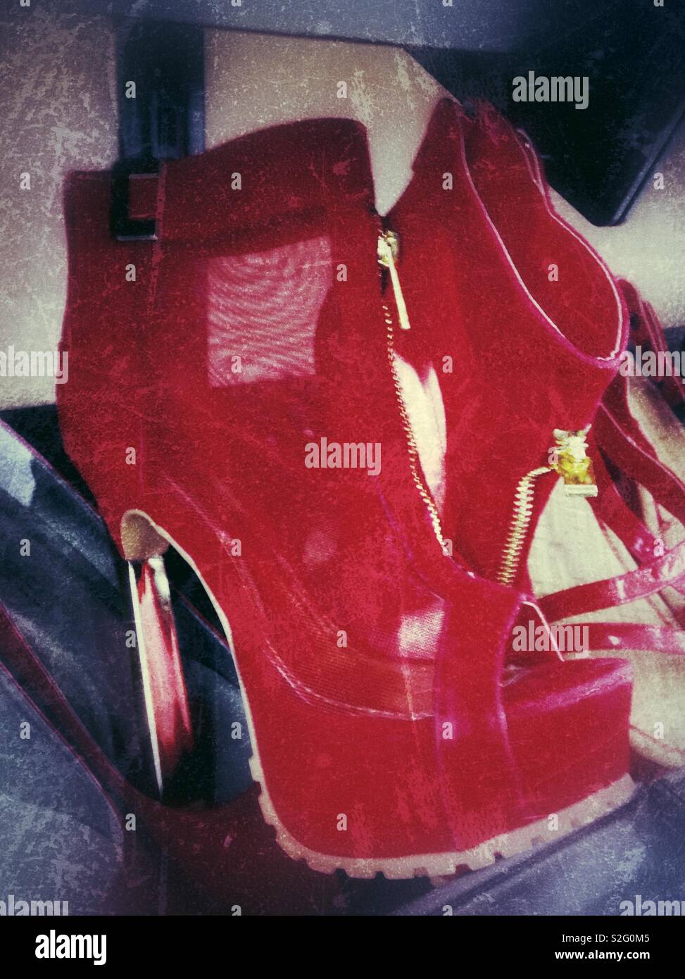 Grunge effect on photo of red mesh stiletto heeled shoes with gold trim found at thrift store - Smartphone Captured Stock Image
