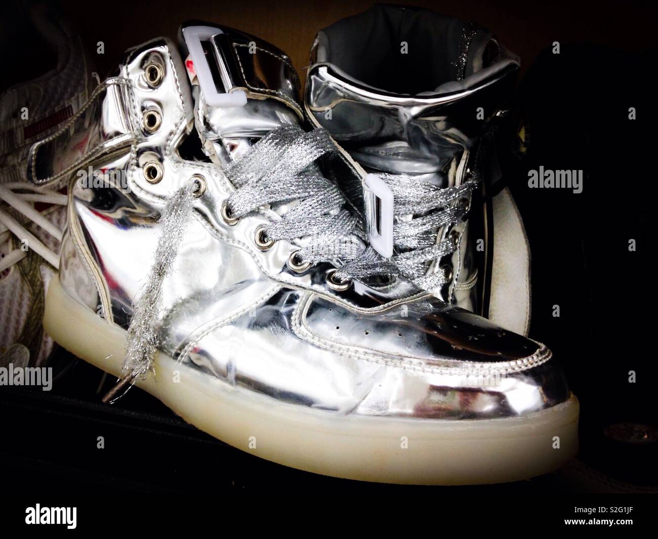 shiny silver tennis shoes