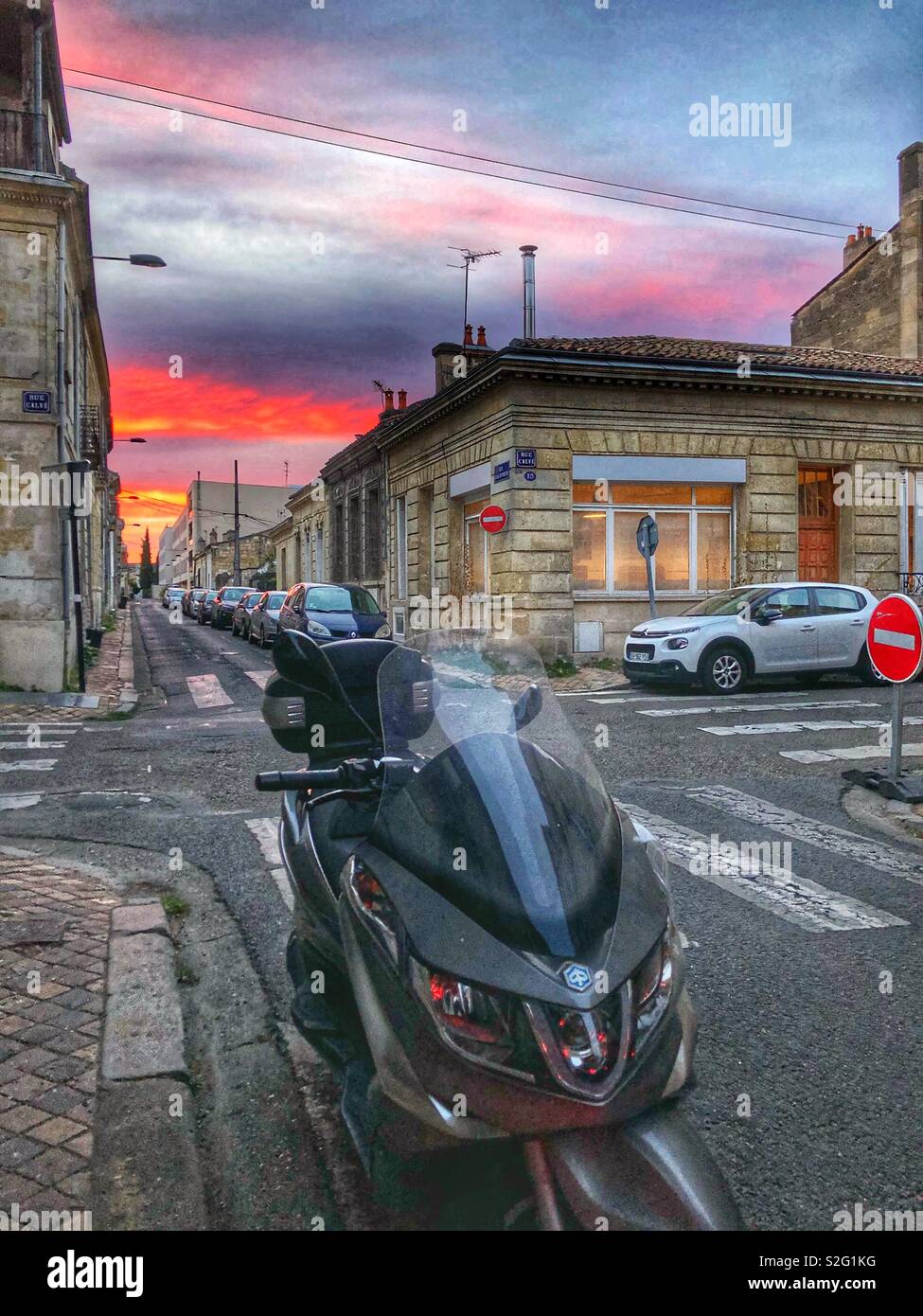 The setting sun seen on the horizon in Bordeaux, France. - Smartphone Captured Stock Image