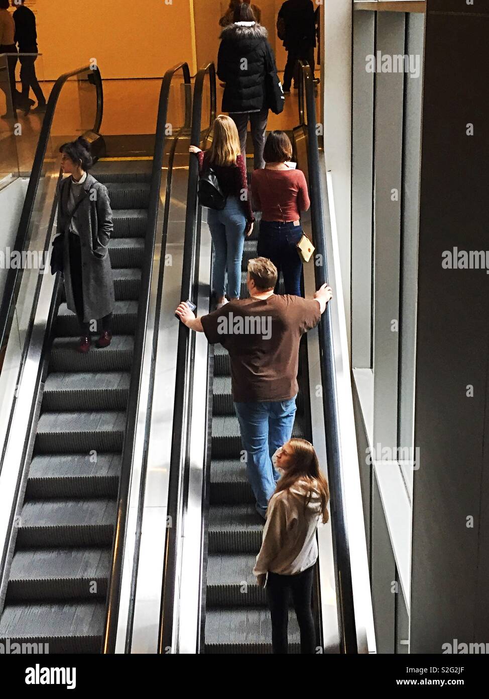 Up and down escalators filled with people, USA - Smartphone Captured Stock Image