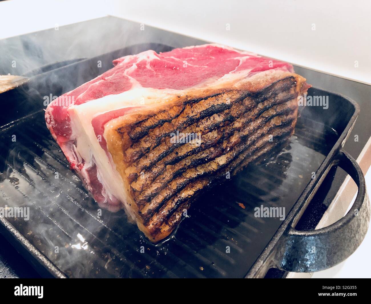 Searing a joint of roast beef - Smartphone Captured Stock Image
