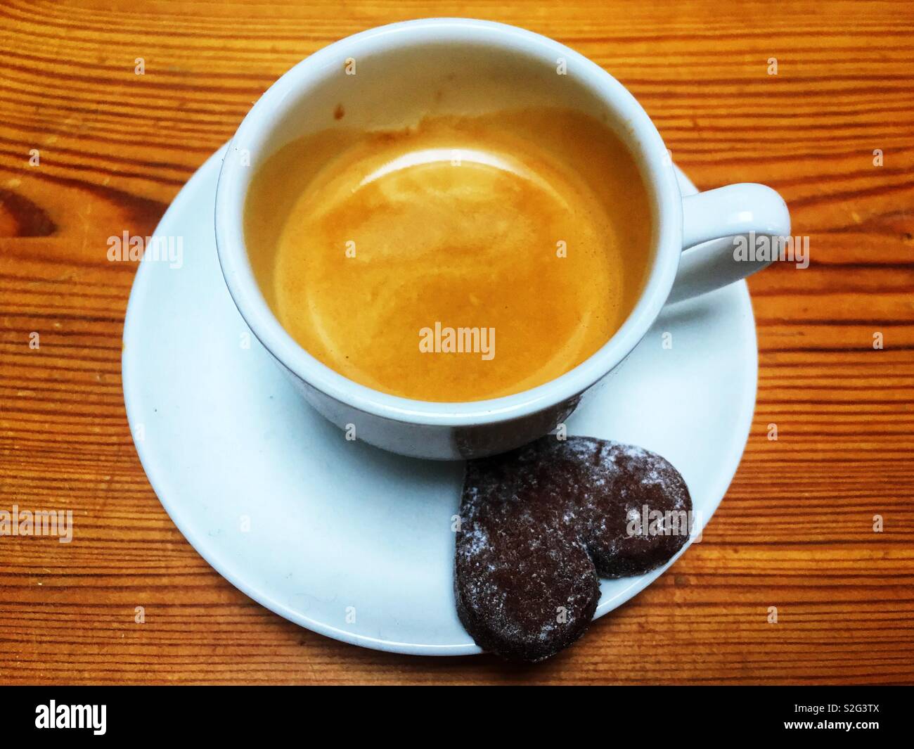 Espresso coffee with M&S cocoa and almond biscuit - Smartphone Captured Stock Image