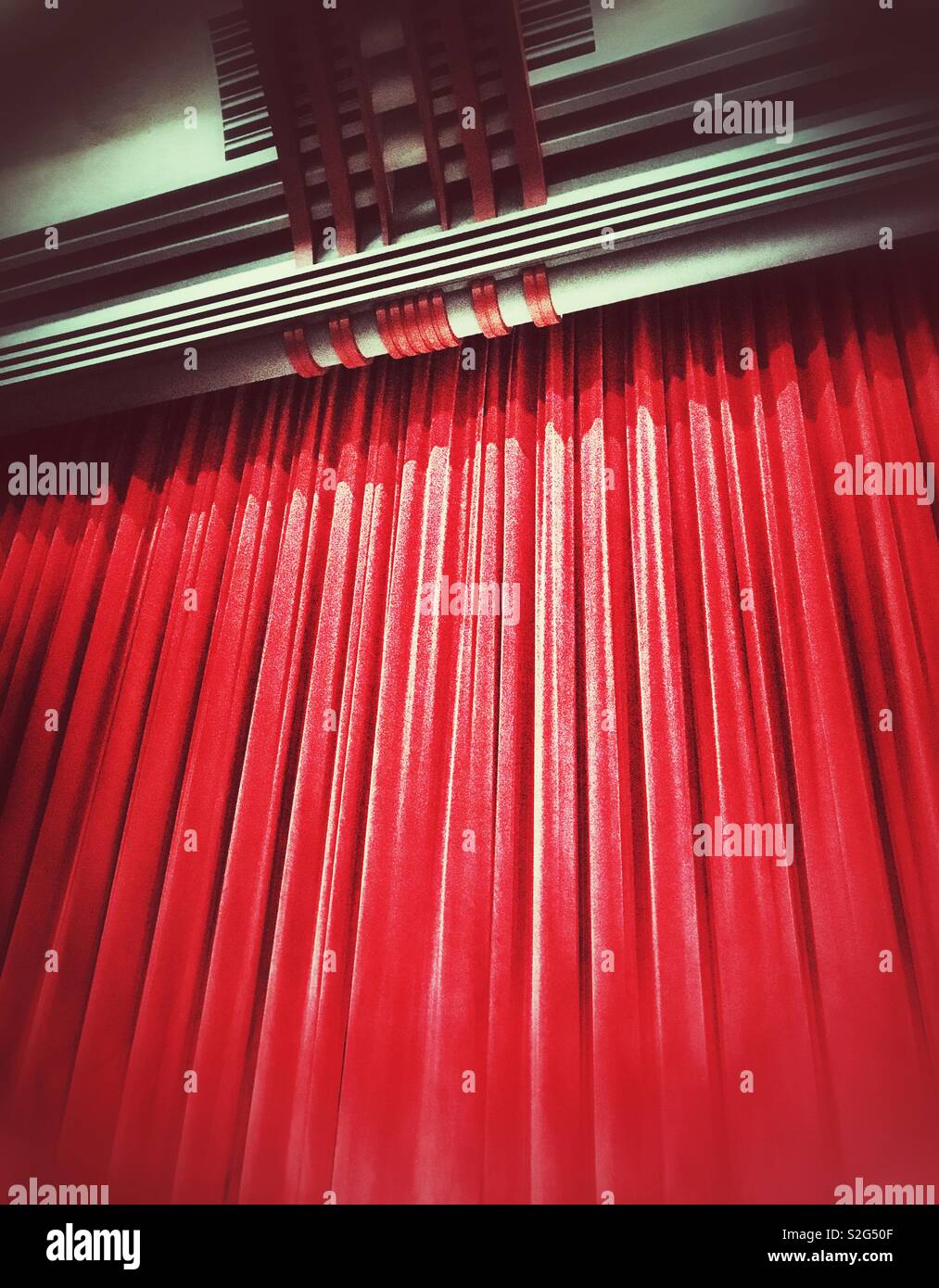 The red curtain at the end of a theatre show - Smartphone Captured Stock Image