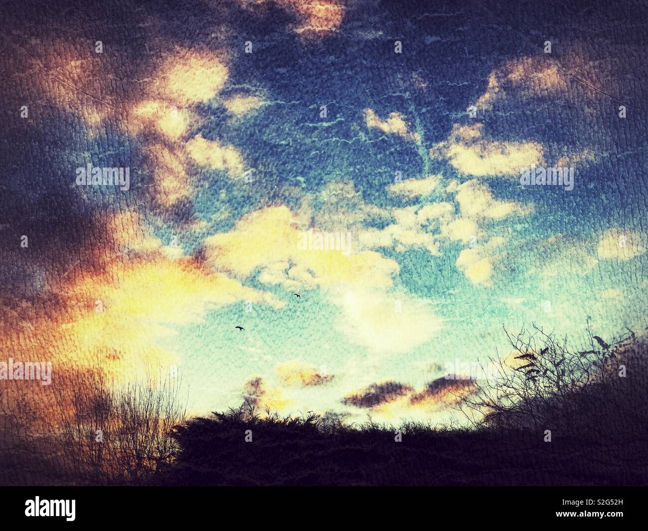 Orange and blue sunrise with grunge filter - Smartphone Captured Stock Image