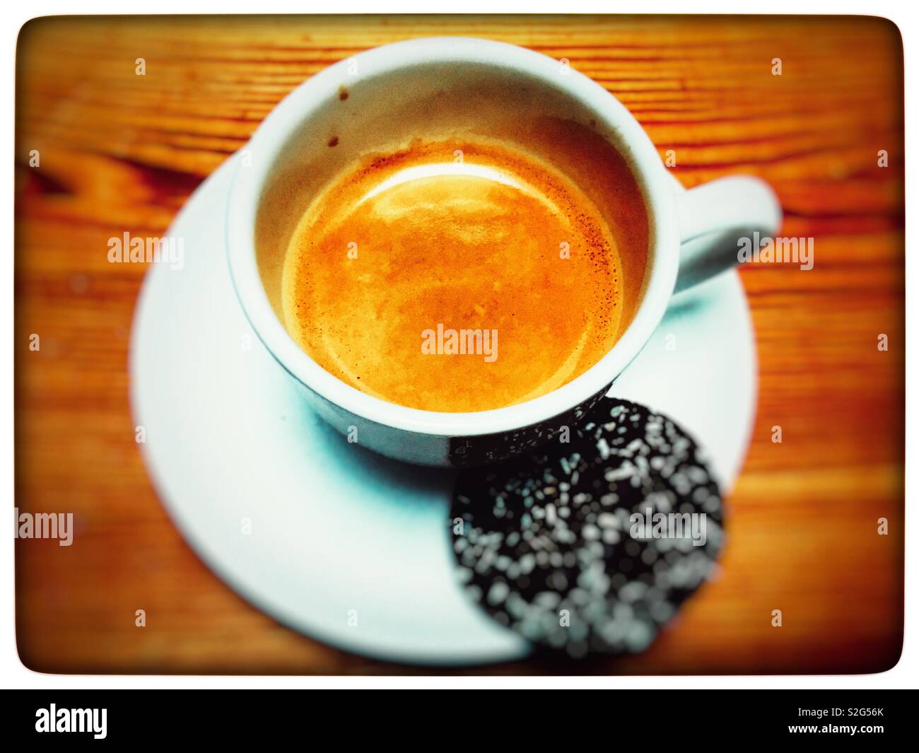 Espresso coffee with M&S Belgian chocolate biscuit with coconut sprinkles - Smartphone Captured Stock Image