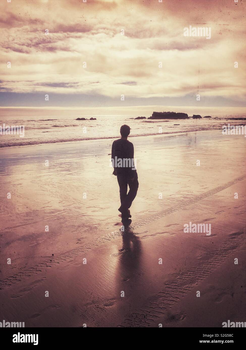 Man walking on the beach. - Smartphone Captured Stock Image