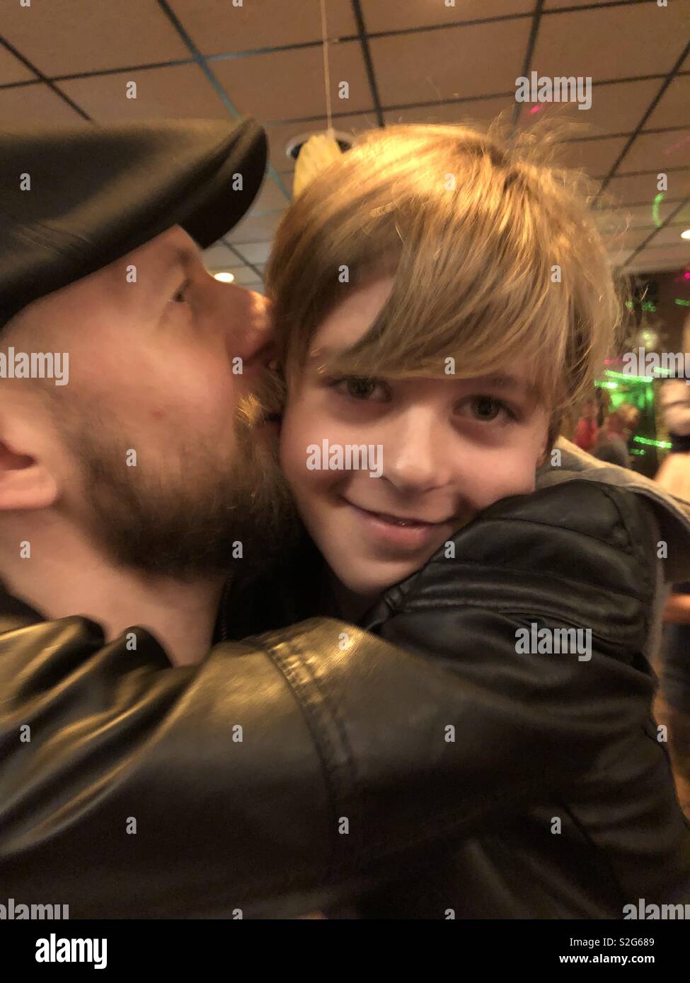 Man hugging and kissing his son Stock Photo