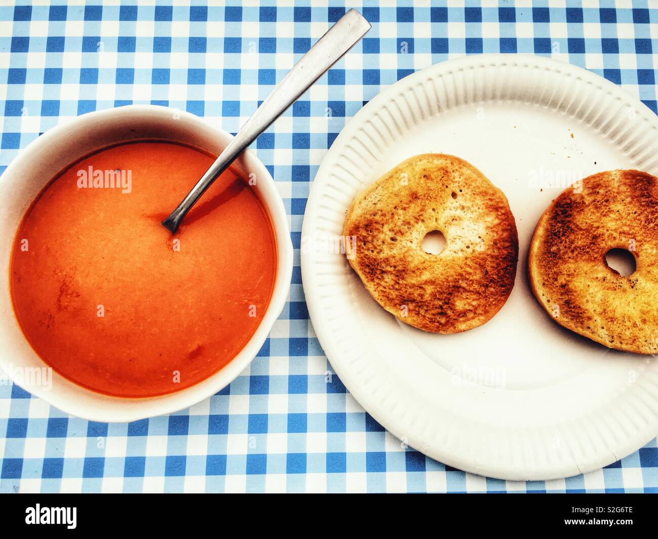 Tomato soup with toasted bagel Stock Photo