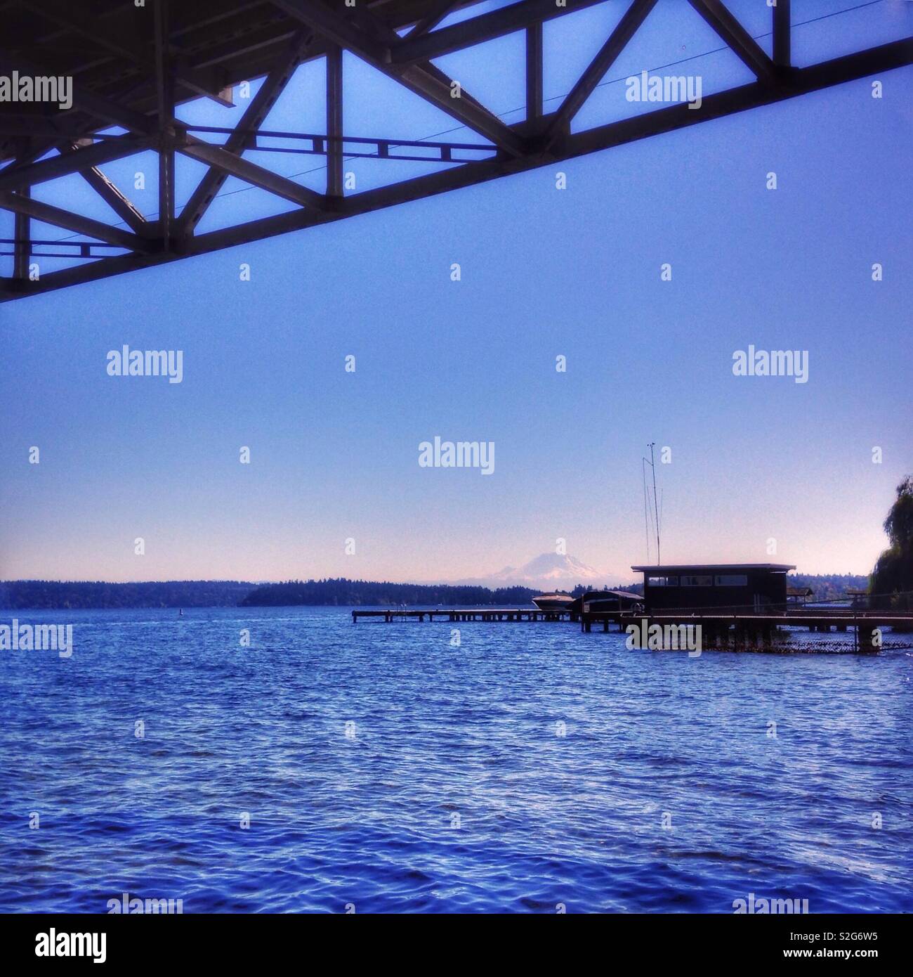 Mt.  Ranier in background of view from underneath the I90 bridge over Lake Washington, Seattle - Smartphone Captured Stock Image