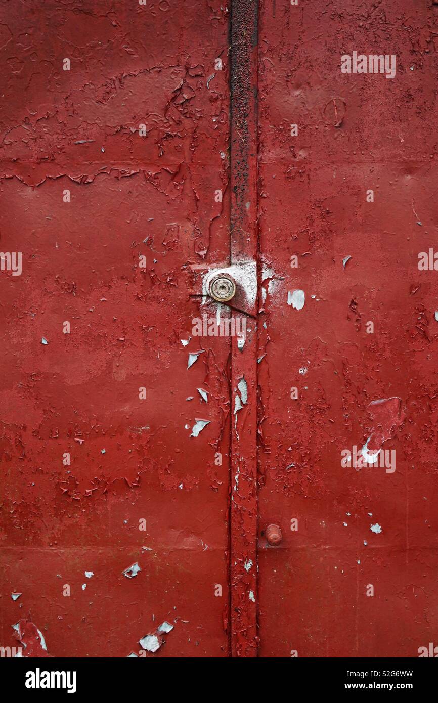 metallic red door texture pattern Stock Photo
