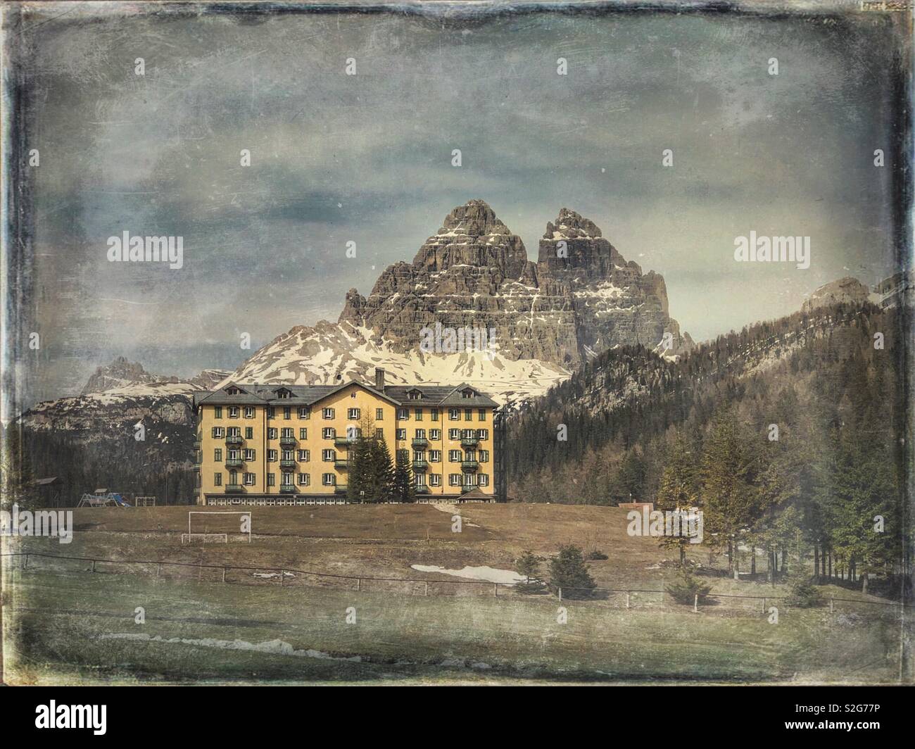 Hotel In Misurina With The Tre Cime Di Lavaredo In The Background hotel-in-misurina-with-the-tre-cime-di-lavaredo-in-the-background