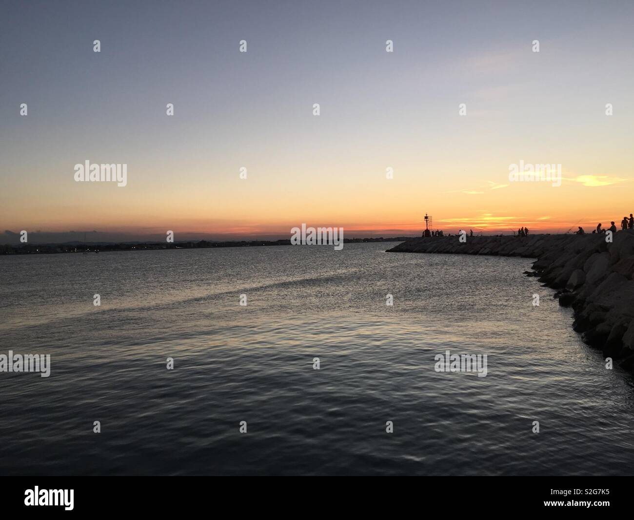 Sunset rimini port Stock Photo