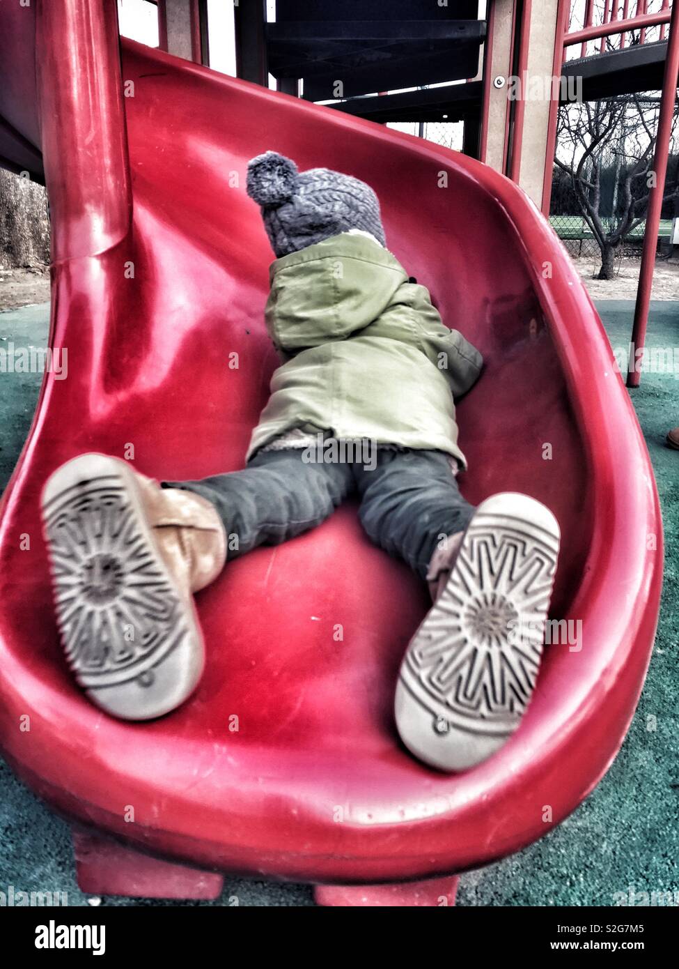 A boy having fun at a slide - Smartphone Captured Stock Image