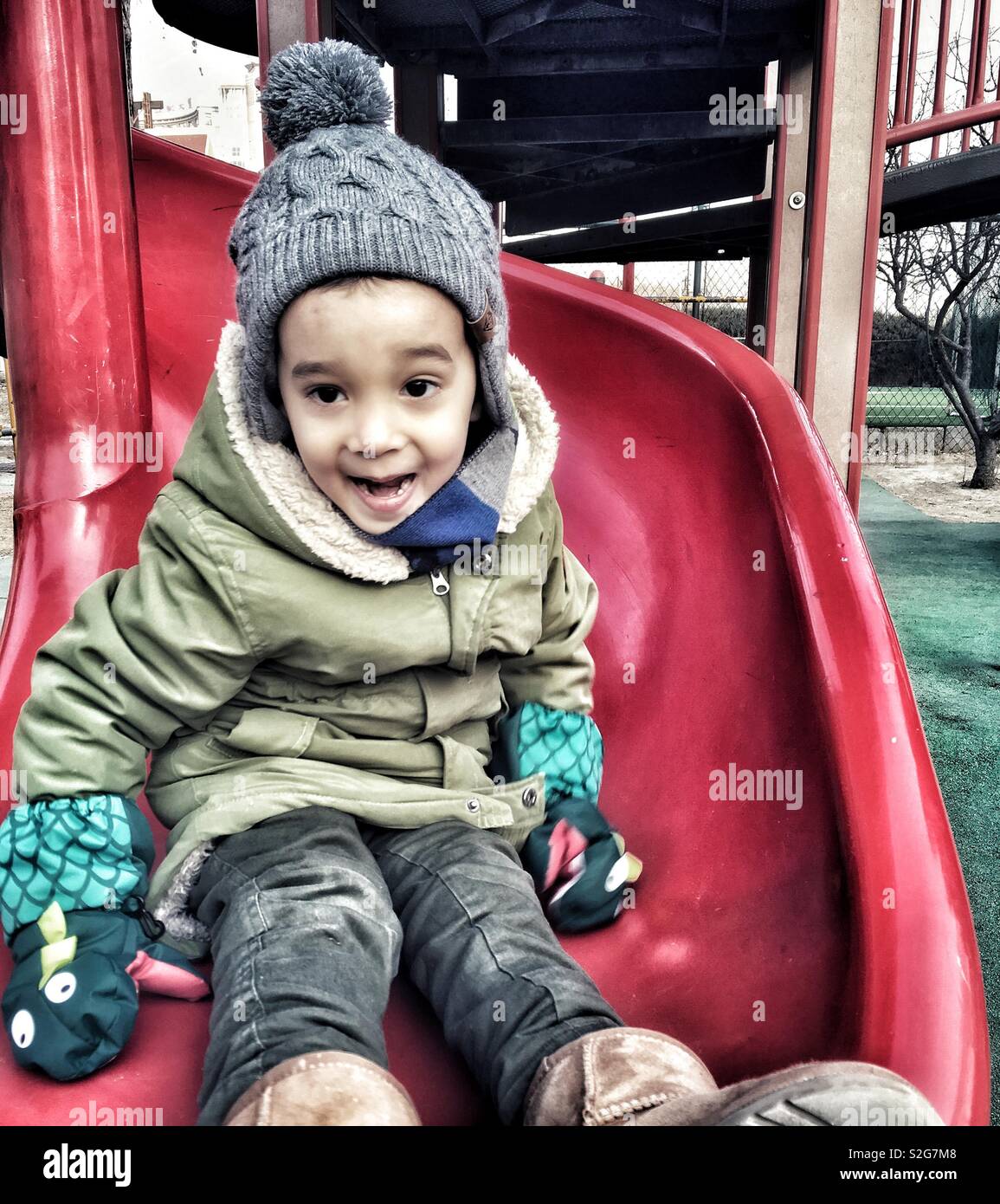 A boy having fun on a slide - Smartphone Captured Stock Image