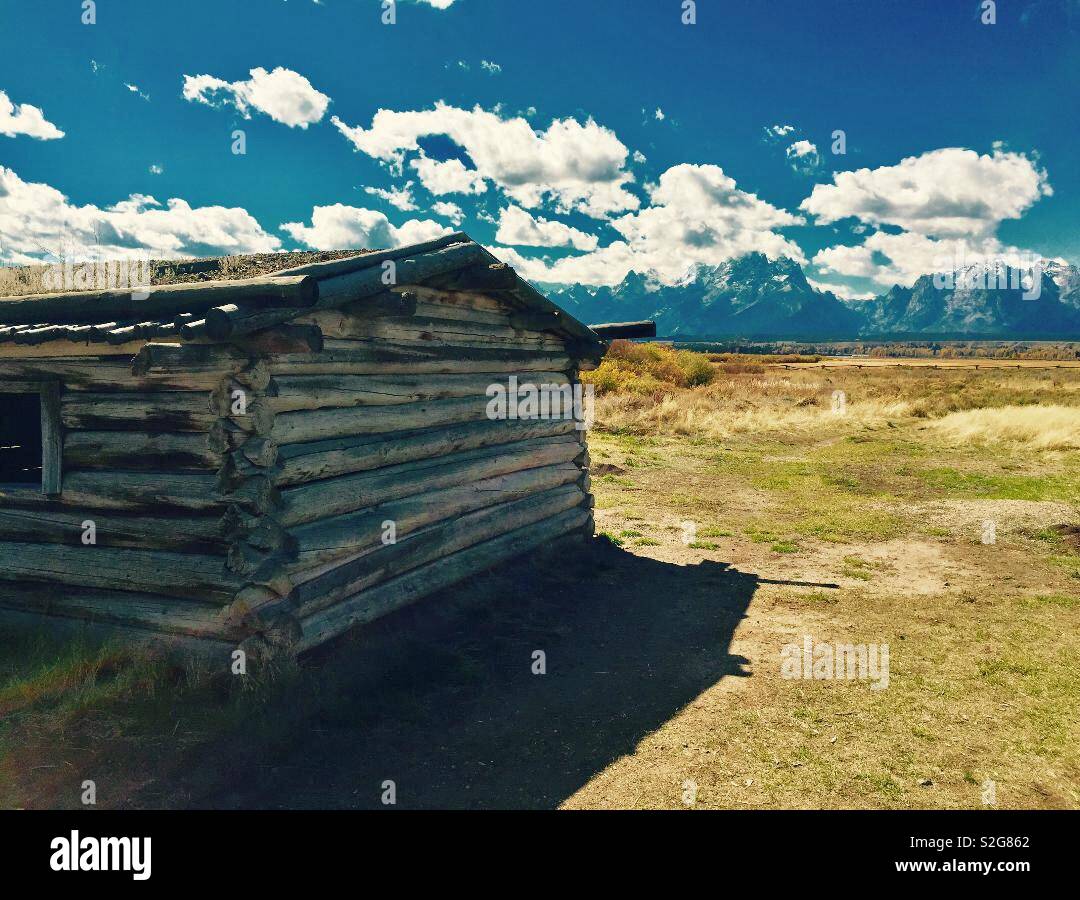 Abandoned Cunningham Cabin looking out over the grand Teton mountains in Wyoming USA Stock Photo