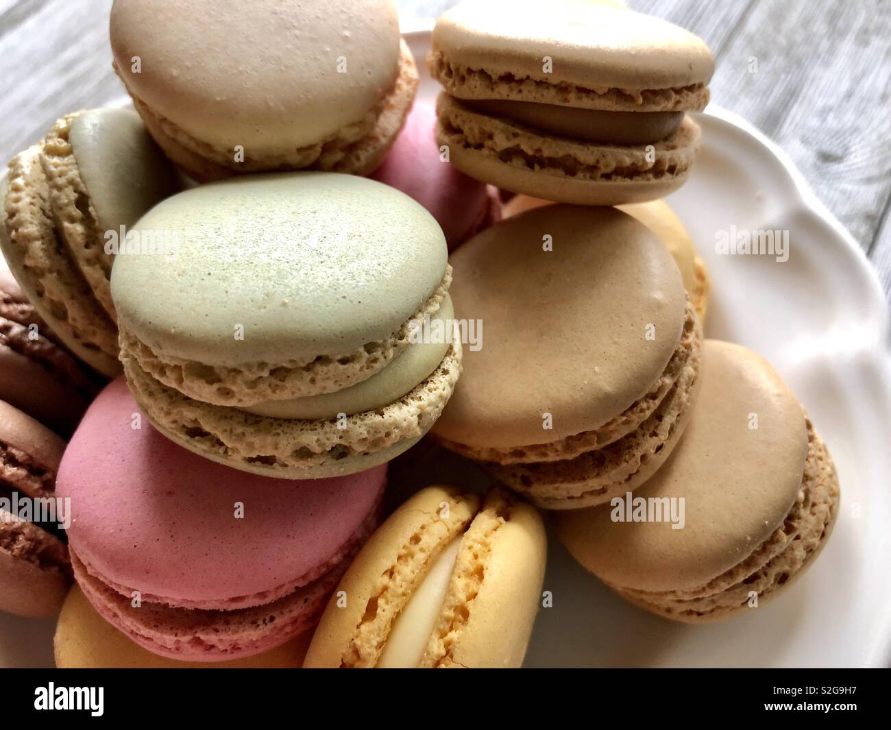 Pastel macarons on a white plate Stock Photo