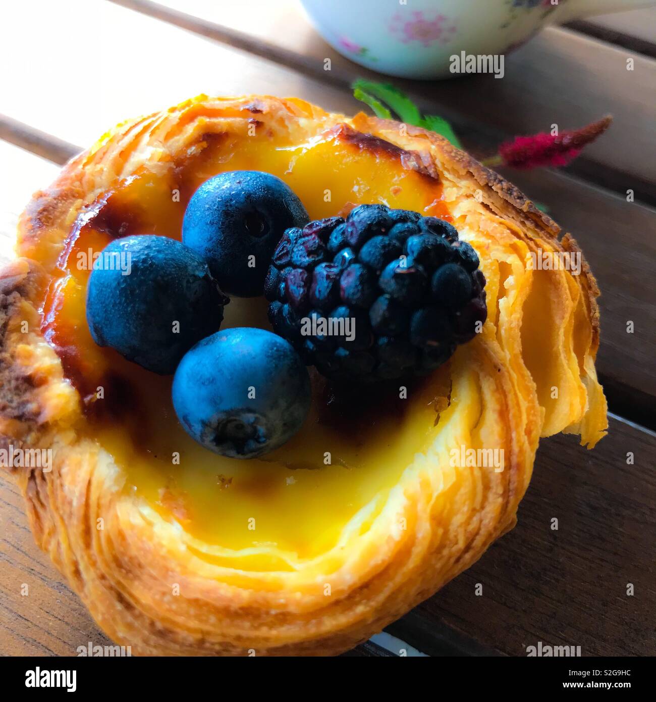 Pastel de Belem, also known as pastel de nata, a delicacy produced in Lisbon, Portugal - Smartphone Captured Stock Image