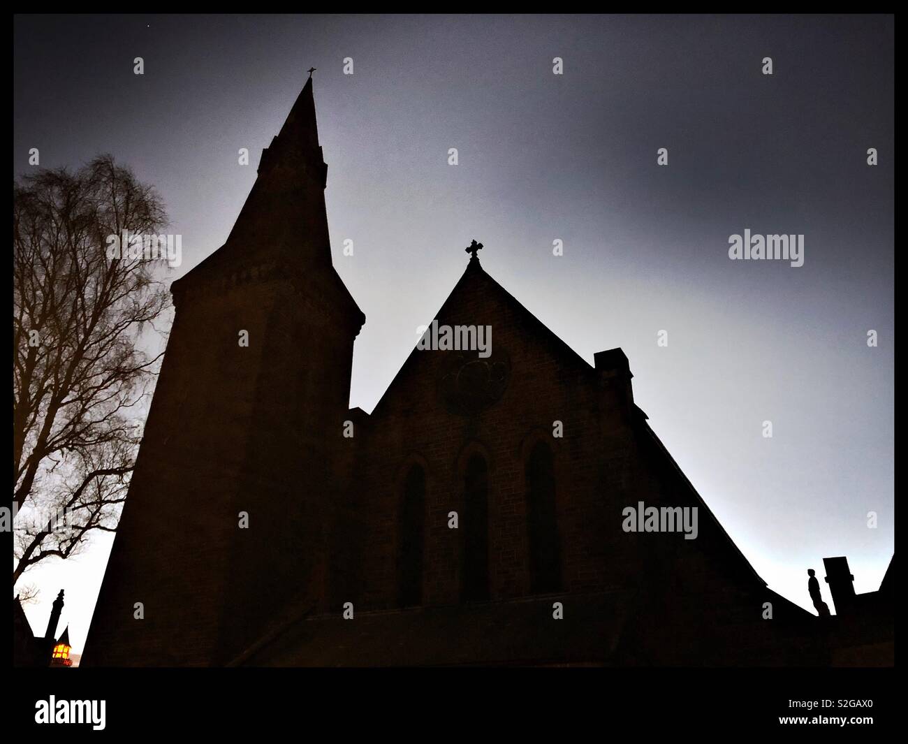 St. John’s Episcopal church in silhouette at sunrise in Dumfries town centre, Scotland. - Smartphone Captured Stock Image