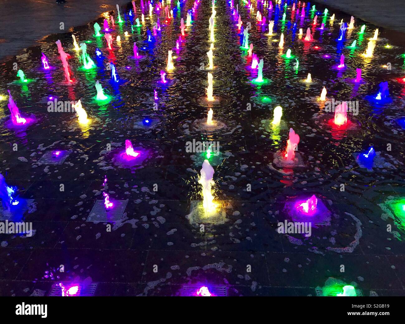 Multi coloured water fountains at Granary Square at Kings Cross, London