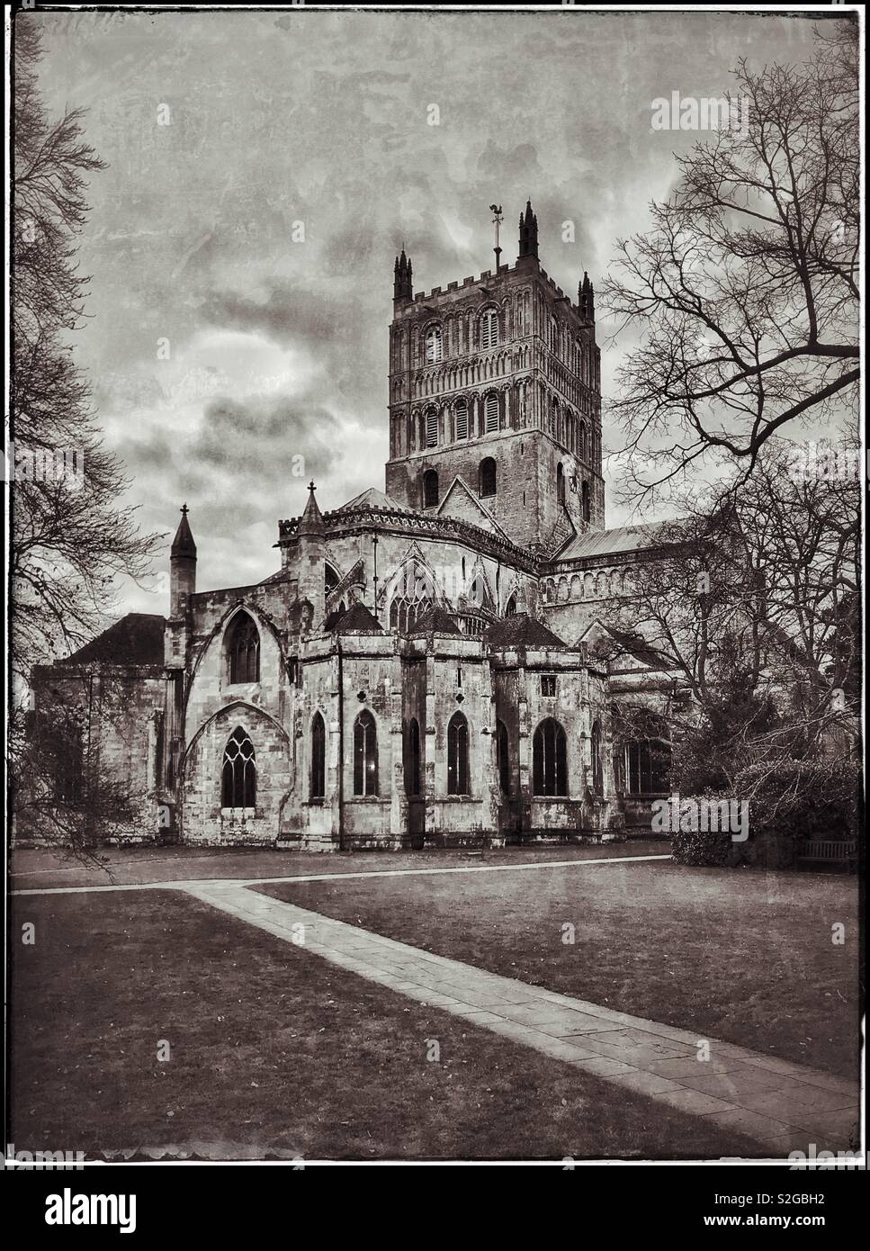 A retro and grunge effect image of Tewkesbury Abbey (Church of St. Mary the Virgin). This Parish Church is a fine example of Norman Architecture & is in Gloucestershire, England. Photo © COLIN HOSKINS - Smartphone Captured Stock Image