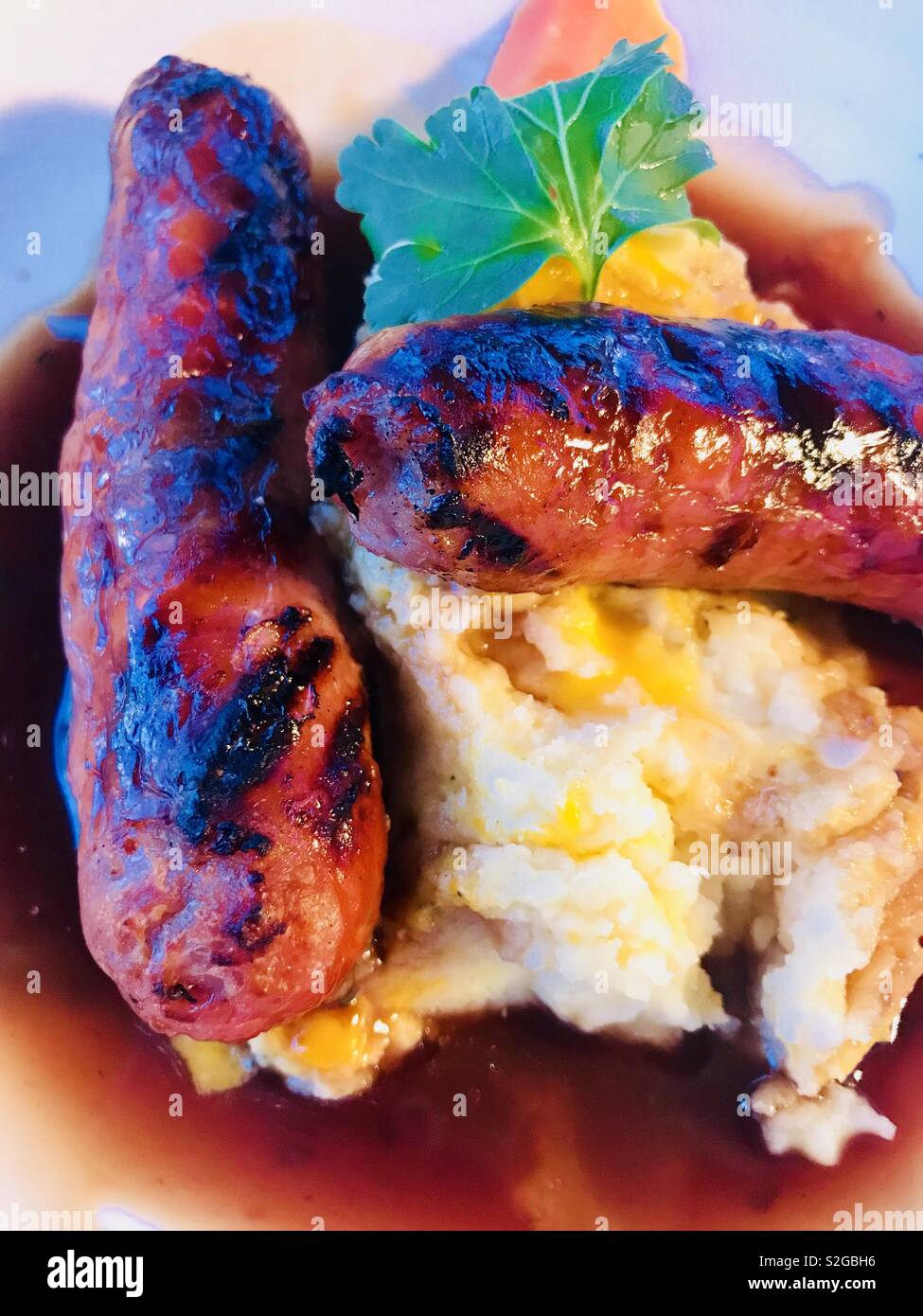 Sausage and mashed potatoes with gravy Stock Photo Alamy