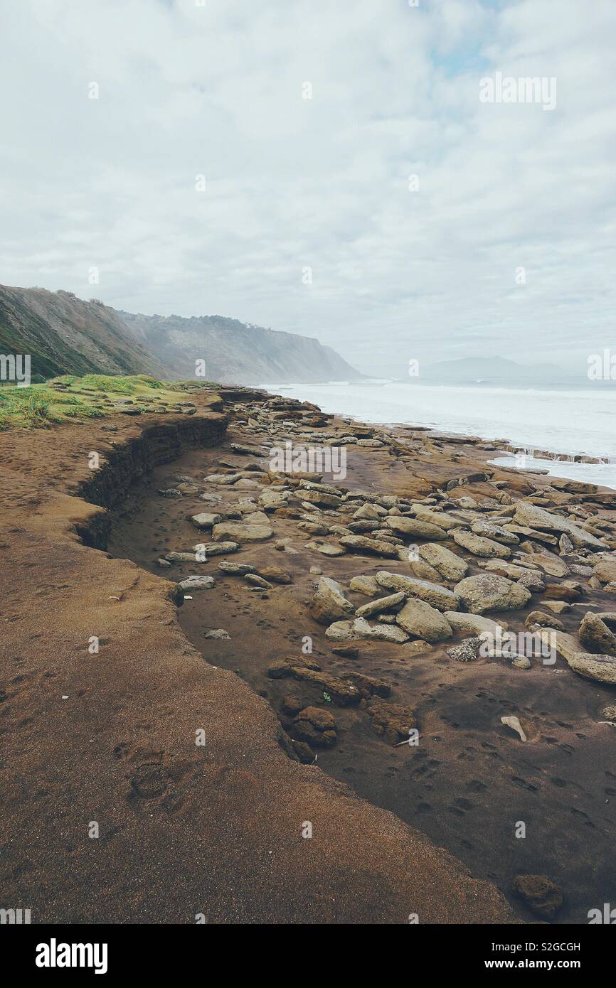 snad and rocks in the beach in the coast Stock Photo - Alamy