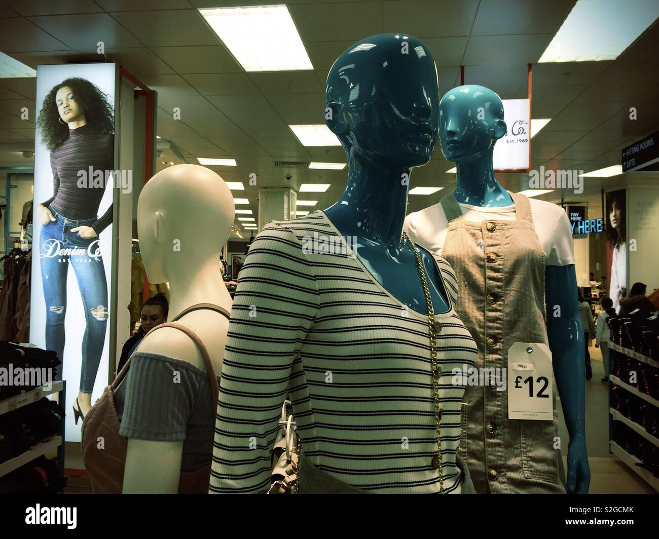 Mannequins in a clothes shop display the latest fashions. - Smartphone Captured Stock Image