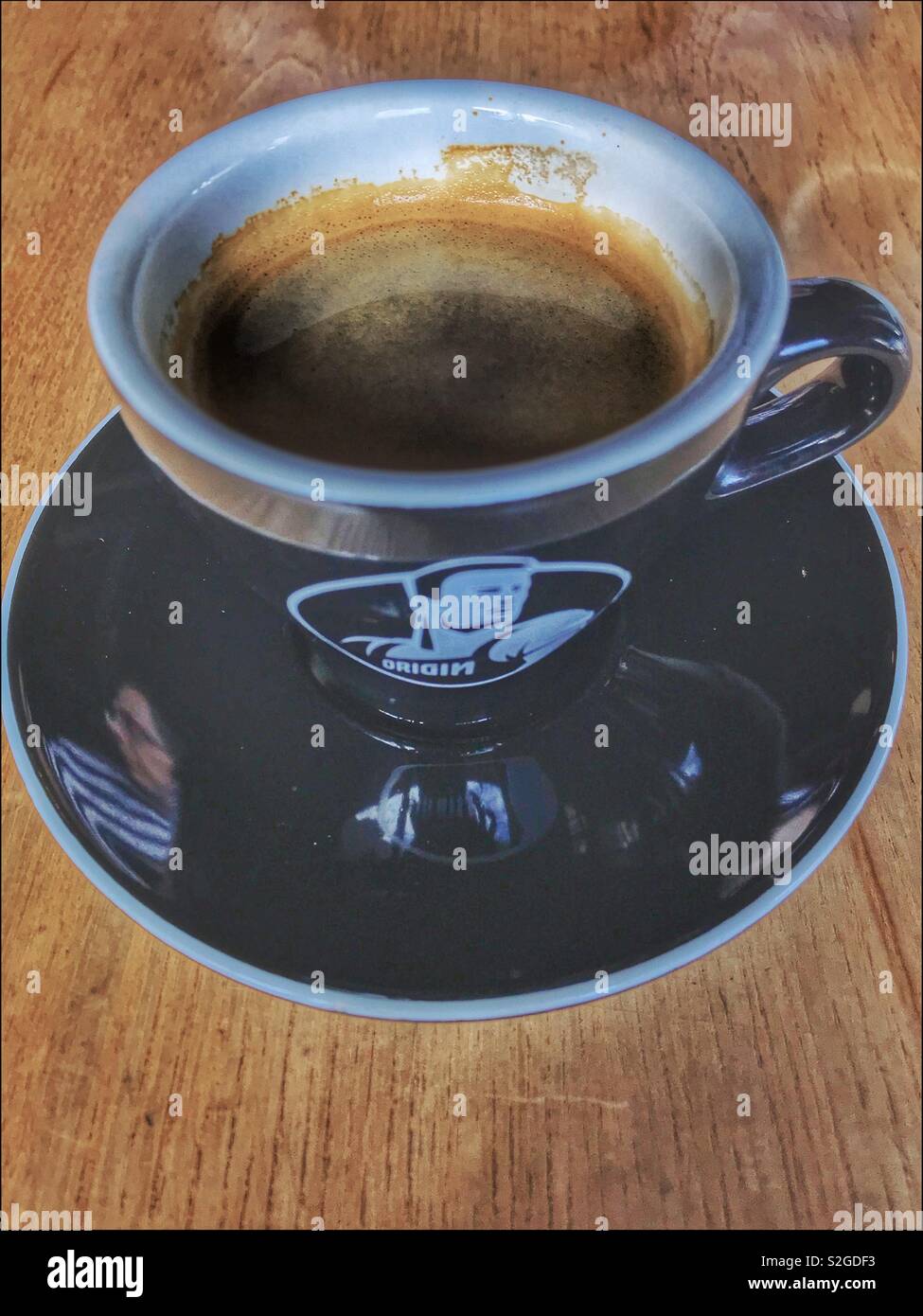 Cup of Origin coffee. - Smartphone Captured Stock Image