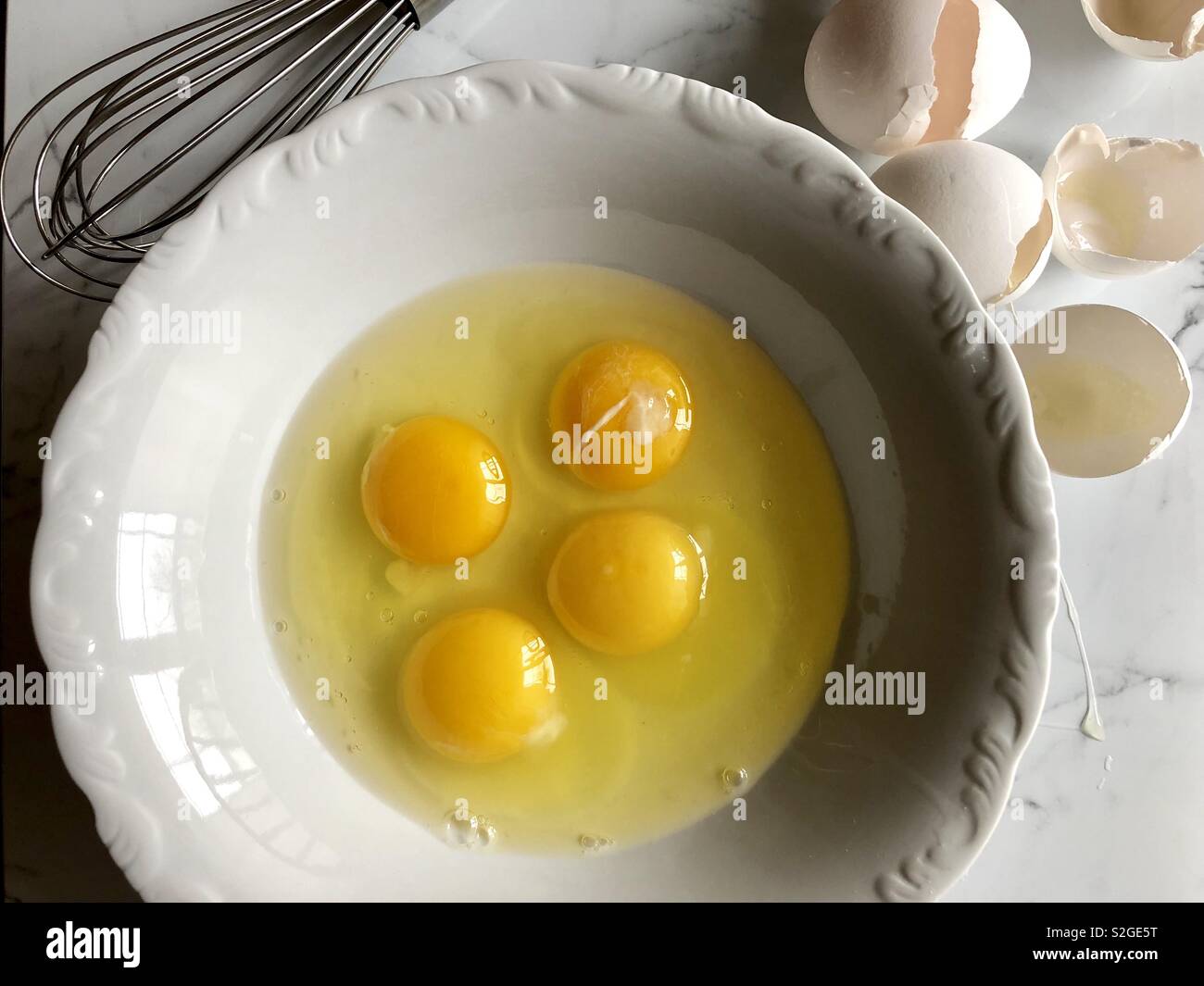 Egg yolks in a white bowl - Smartphone Captured Stock Image