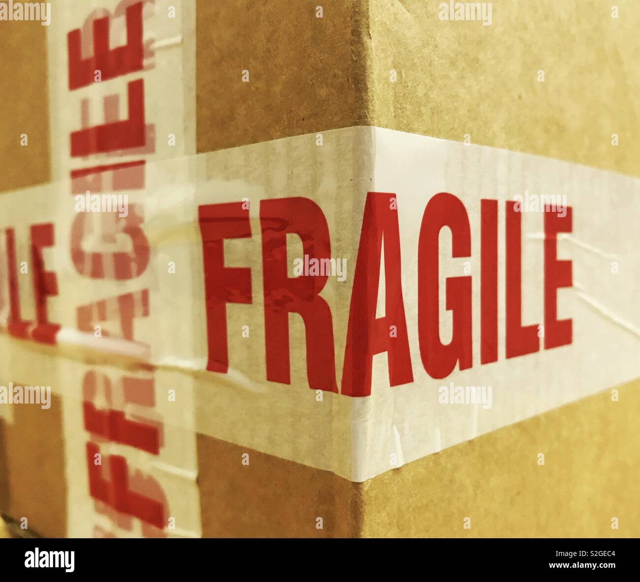 Cardboard delivery box marked “Fragile” Stock Photo