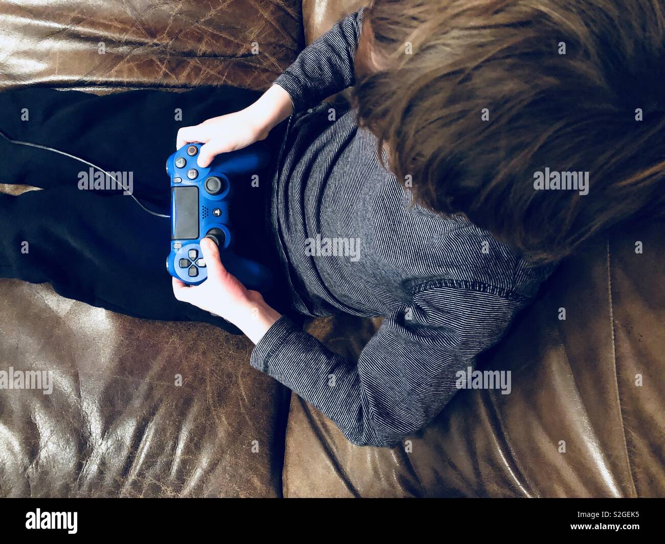 boy playing playstation boy playing playstation