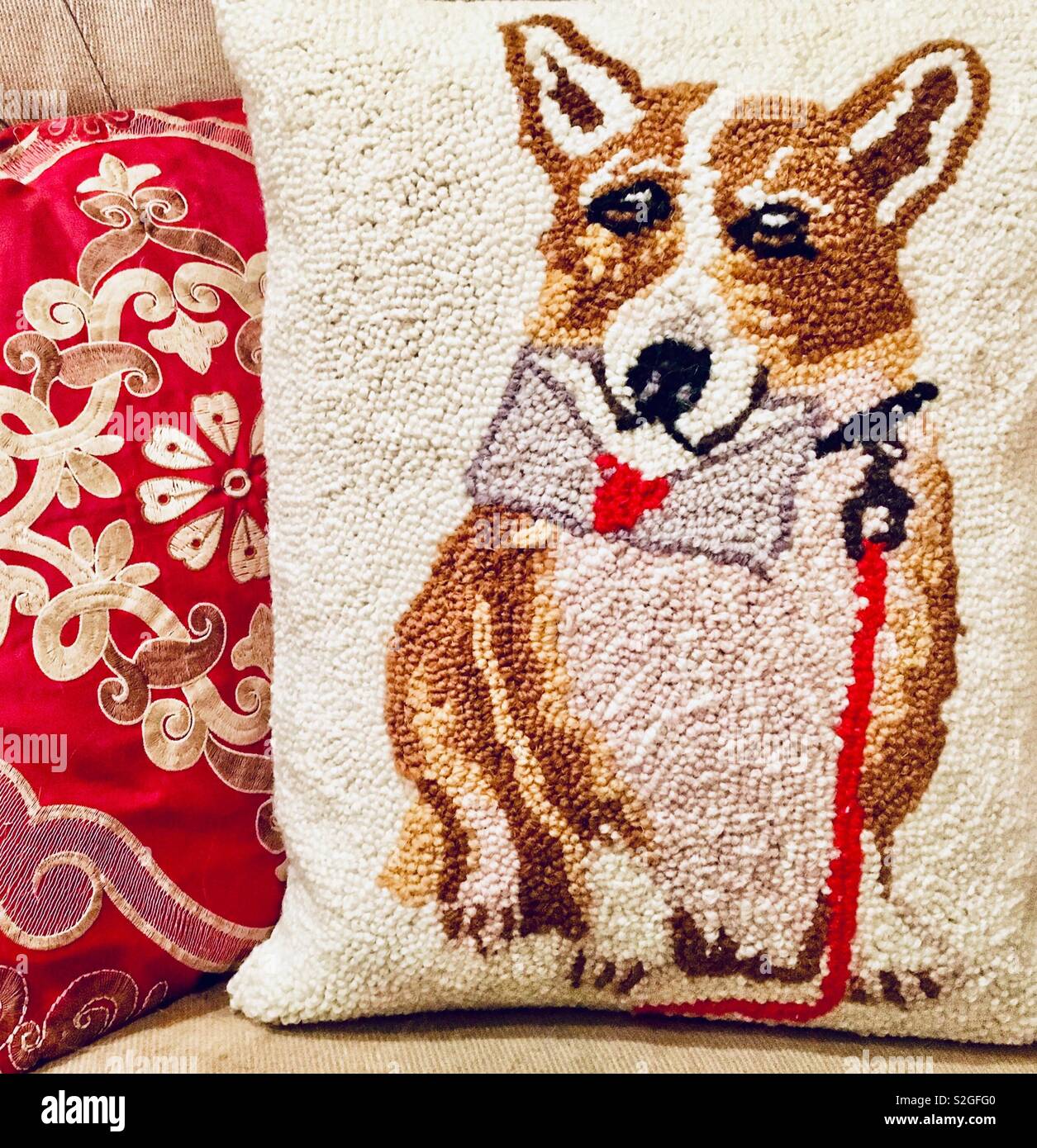 Valentine’s Day pillow decor with red and gold embroidered pillow and hooked pillow of