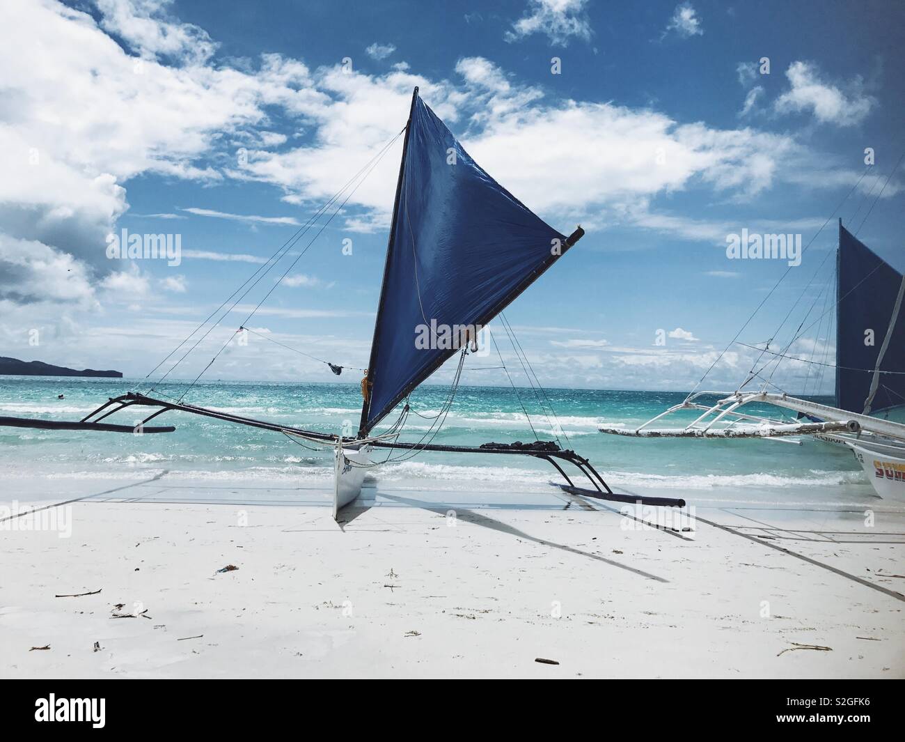 Blue Boat on White Beach Stock Photo - Alamy