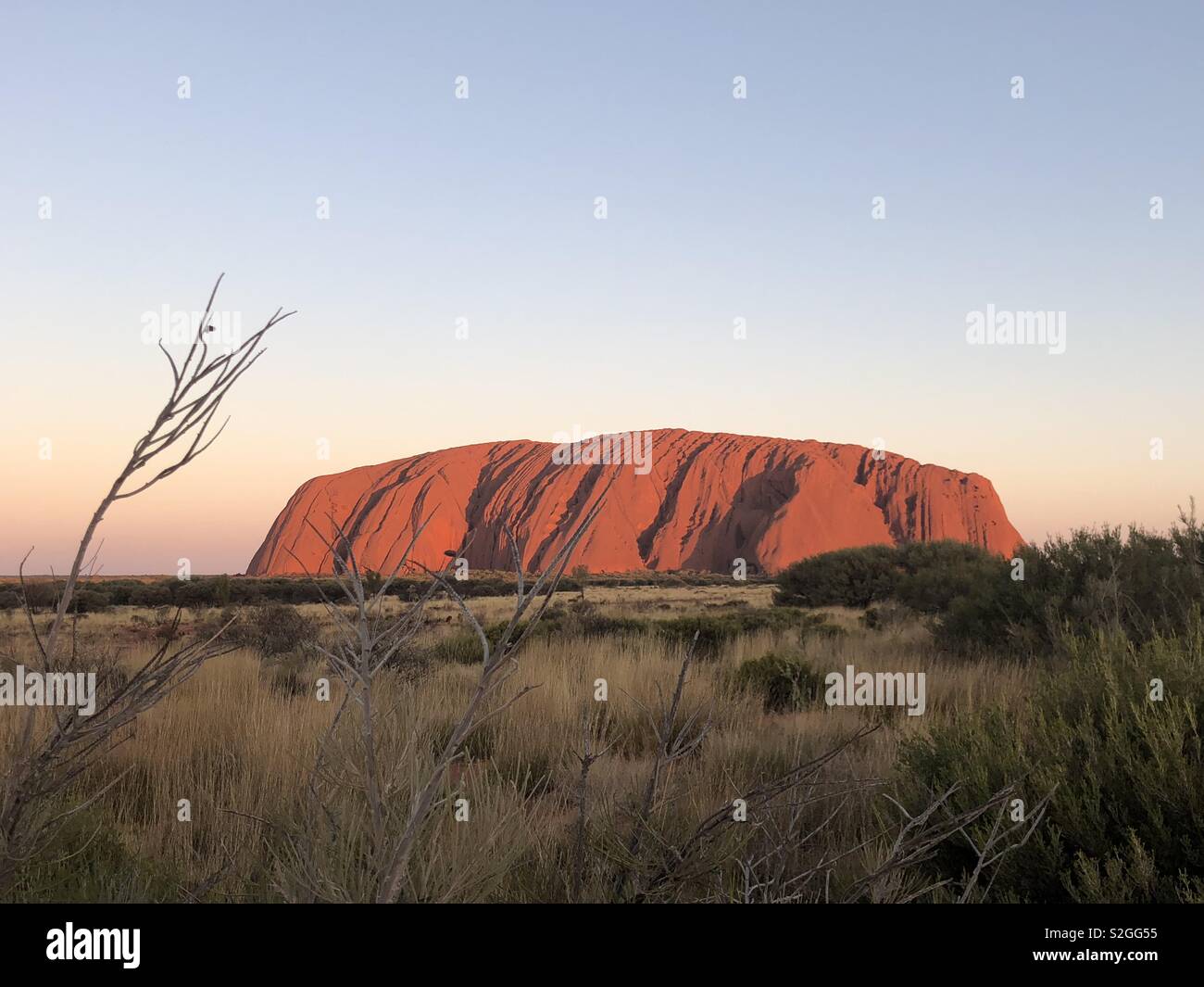 Sunset at Uluru (Ayers Rock) in Central Australia Stock Photo