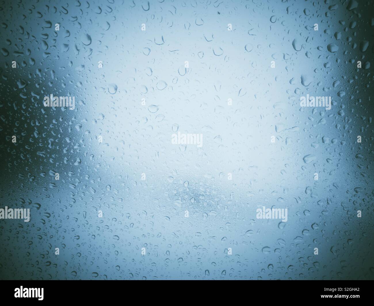 Water drops on  a car window glass Stock Photo