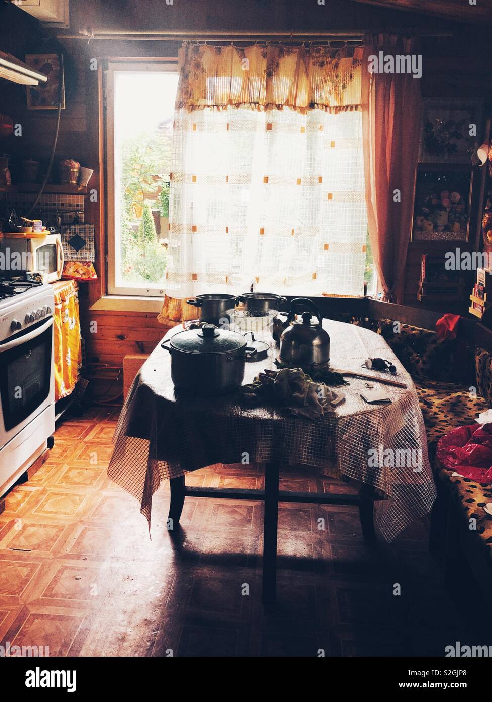 Sunlit Kitchen in Russian dacha summer house Stock Photo
