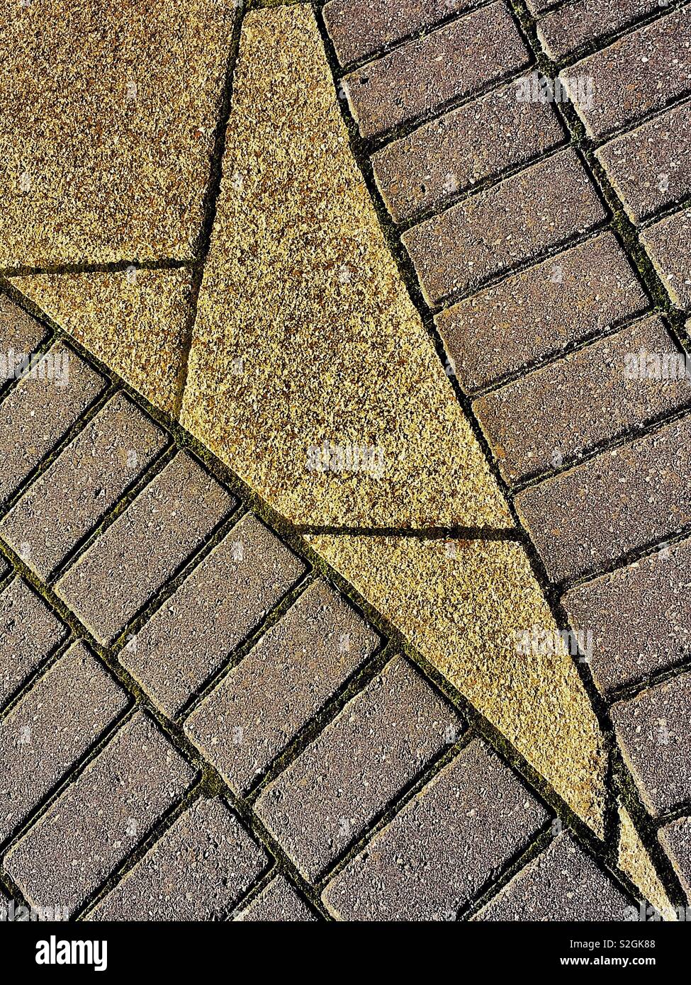 Pattern of paving slabs and bricks on a pavement or sidewalk, for background with copy space Stock Photo
